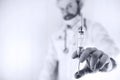 Black and white photo of bearded doctor in white coat and an ol Royalty Free Stock Photo