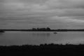 Black white photo, blurred background, out of focus. Fisherman on a boat in the fall Royalty Free Stock Photo