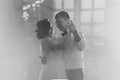 Black and white photo bride and groom dancing the first dance in the blurry background Royalty Free Stock Photo