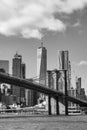 Black and White Photo of the Brooklyn Bridge with an American Flag over the East River with the Lower Manhattan New York City Skyl Royalty Free Stock Photo