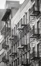 Black and white photo of buildings with fire escapes, New York City, USA Royalty Free Stock Photo