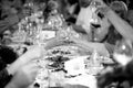 Black and white photo of celebrating people clinking glasses Royalty Free Stock Photo