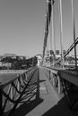 Black and white photo of Chain bridge in Budapest, Hungary during day with shadows.