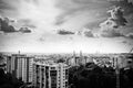 Black and white photo of city view roofs and cloudy sky