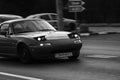 Black and white photo, classic, vintage car. Classic car with hidden headlight on the roads of Bucharest, Romania, 2020