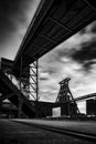 a black and white photo of a coal mine tower at night Royalty Free Stock Photo
