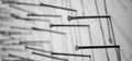 Black and white photo of construction nails that are driven into the canvas and cast a shadow on it. macro photography of construc Royalty Free Stock Photo