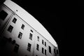 The black-white photo depicts old houses and an entrance to a courtyard well through an archway. Nostalgia and timelessness,