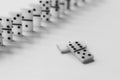 Black and white photo of a domino board game. Knuckles of dominoes in a row Royalty Free Stock Photo