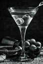 Black and white photo. Dry martini, vermouth with olives, wooden Royalty Free Stock Photo