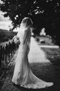 Black and white photo. elegant bride in white dress posing. Bride portrait and hairstyle, fashion bride. wedding day Royalty Free Stock Photo