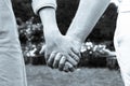 Black & White photo - Engagement: Future husband and wife holding hands and walking together Royalty Free Stock Photo