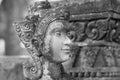 Black and white photograph of light and shadow on a stucco artwork of an angel