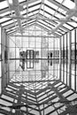 Black and white photo of the geometric shape of the glass dome with the rear view of a couple Royalty Free Stock Photo