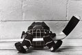 Black and white photo of hockey accessories: helmet, stick, gloves