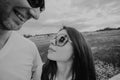 Black and white photo. holidays, vacation, love and friendship concept - smiling couple in sunglasses having fun in summer park Royalty Free Stock Photo