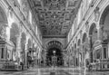 Black and white photo of interior hall of catholic roman cathedral