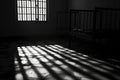 A black and white photo of a jail cell. Perfect for illustrating crime and punishment or prison-related concepts Royalty Free Stock Photo