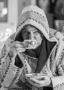 Black and white photo of a man in a robe drinking tea after a bath, portrait of a man Royalty Free Stock Photo