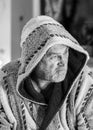 Black and white photo of a man in a robe drinking tea after a bath, portrait of a man Royalty Free Stock Photo