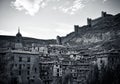 Black and white photo of the medieval town of Albarracin in Teruel (spain), with its stacked houses and its wall