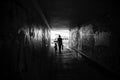 Black and white photo of mother with baby in underpass with graffiti Royalty Free Stock Photo