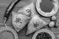 Black and white photo, National Uzbek samsa dishes, tomatoes, red pepper and condiments on a brown wooden table