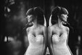 Black and white photo with the noise of a beautiful cheerful young bride in a luxury white dress. displaying the bride in the Royalty Free Stock Photo