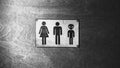 Black and white photo with noise. Gender neutral sign for the restroom. Inclusive concept Royalty Free Stock Photo