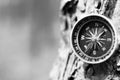 Black and white photo of an old compass in retro style / tourist compass closeup Royalty Free Stock Photo