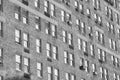 A black and white photo of an old residential building with brick facade and windows, New York City, USA Royalty Free Stock Photo