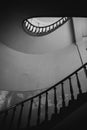 Black and white photo of old spiral staircase, spiral stairway inside old house in Budapest, Hungary Royalty Free Stock Photo