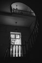 Black and white photo of old spiral staircase, spiral stairway inside old house in Budapest, Hungary Royalty Free Stock Photo