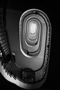 Black and white photo of old spiral staircase, spiral stairway inside old house in Budapest, Hungary