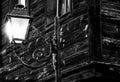 Old wooden house and old pattern lantern with white and bright light and with transparent spider web