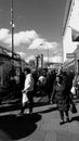 Black and white photo of people shopping in lewisham high street sothhall london.