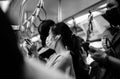 Black and white photo: People traveling by BTS Skytrain in Bangkok must wear a face mask to prevent COVID 19 outbreak in Bangkok