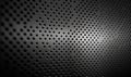 a black and white photo of a perfored surface with holes on it, with a light shining through the center of the perfored surface Royalty Free Stock Photo