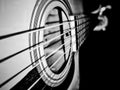 Black and white photo of playing guitar