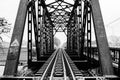 A black and white photo of a railway track on a steel bridge in Taling Chan district, Bangkok. Royalty Free Stock Photo