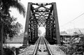 A black and white photo of a railway track on a steel bridge in Taling Chan district, Bangkok. Royalty Free Stock Photo