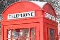 Black and white photo with red telephone booth in classic english style Royalty Free Stock Photo