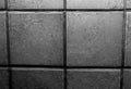 Close up photo of a brick wall/tiled wall in black and white