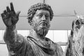 Black and white photo showing in close-up the bronze statue of an roman general on a horse waving with his hand Royalty Free Stock Photo