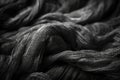 a black and white photo of a skein of yarn