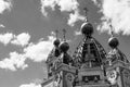 Black and white photo of a sky background with clouds fragment of church domes