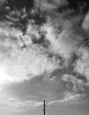 Black and white photo of sky and electric wooden pole. Royalty Free Stock Photo