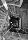 a black and white photo of a staircase robuste with ropes running from the top