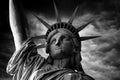 Black and white photo of the Statue of Liberty close-up against a cloudy sky Royalty Free Stock Photo