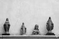 Statues of Jesus and the Virgin Mary on a wall background Royalty Free Stock Photo